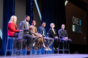 A Q+A panel on stage at the Real Brokerage conference