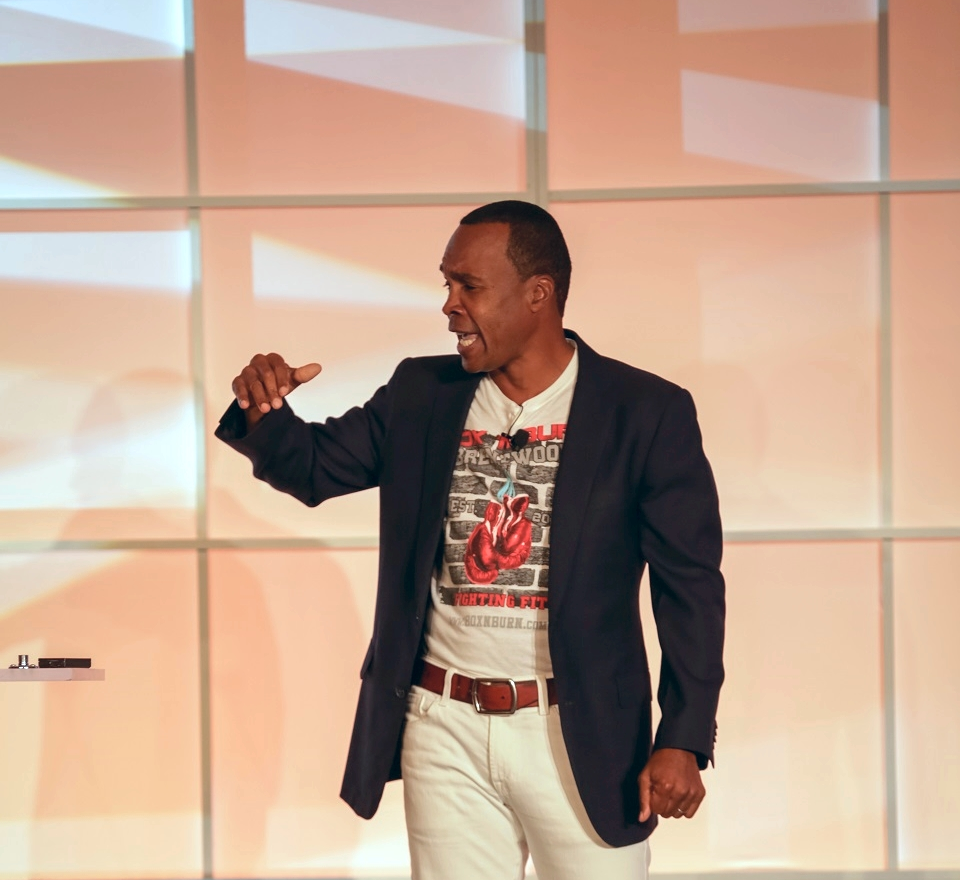 A photo of Sugar Ray Leonard speaking at a recent Tri-Marq event.