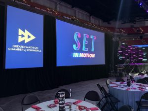 A side view of the projector screens at the GMCC IceBreaker 2026 event in Madison, Wisconsin. Produced by Tri-Marq.