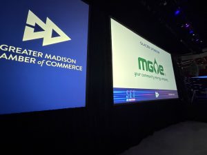 A view of the projector screens at the GMCC IceBreaker event in Madison, Wisconsin. Tri-Marq produces the event annually at the Kohl Center.