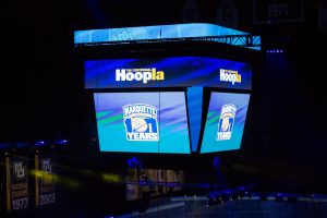 A view of the jumbotron at Fiserv Forum displaying graphics for the centennial hoopla celebration on its various LED boards