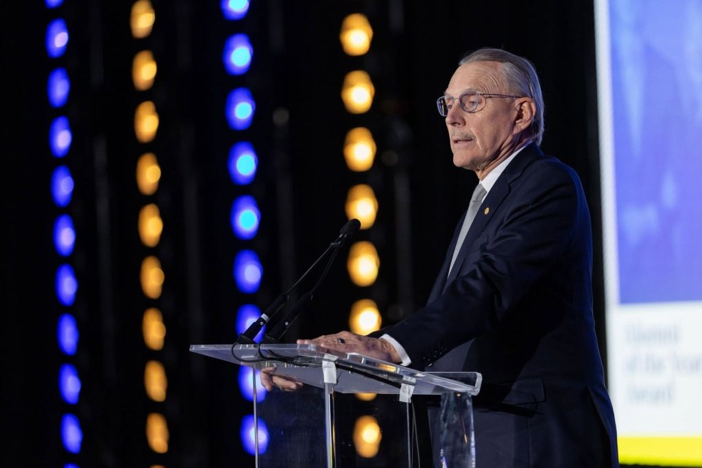 For gallery page: A photo from the Marquette University Alumni National Awards. Features a man speaking at a podium onstage. 