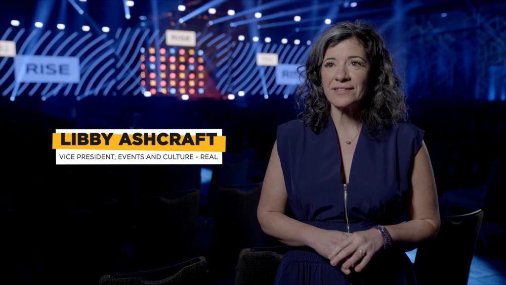 For gallery page: A thumbnail from the Real Brokerage RISE Behind-the-scenes case study video. Features Libby Ashcraft being interviewed for the case study video. 