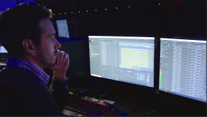 A content producer looks at content while the show is progressing.