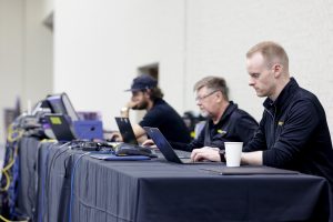 Event producer and executive producer work together behind the scenes at a Tri-Marq event.