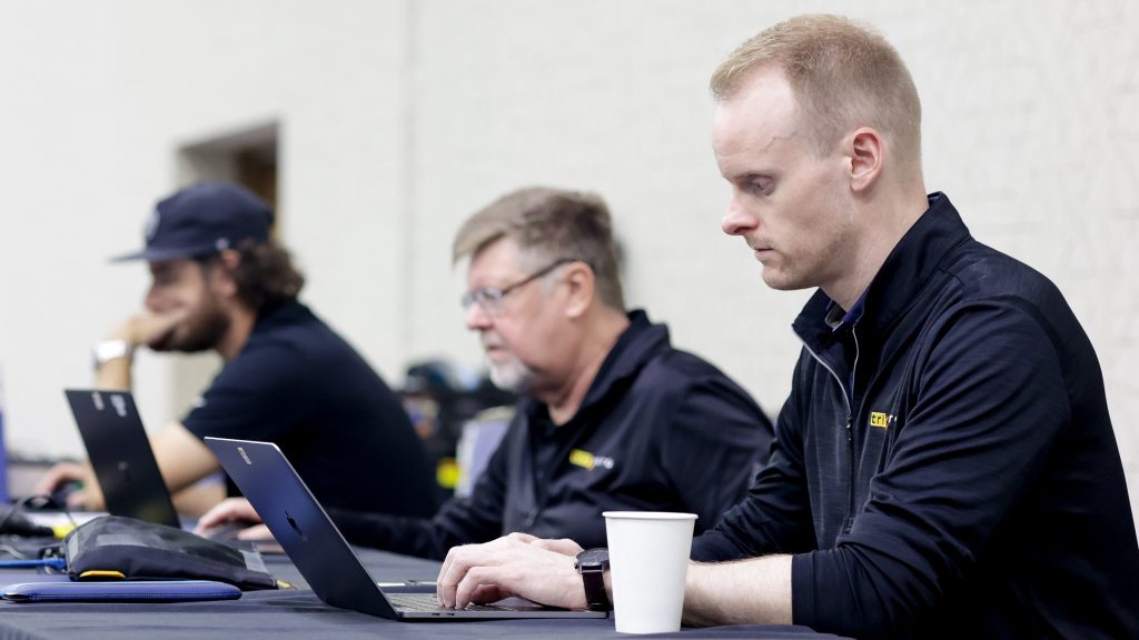 Event producer and executive producer work together behind the scenes at a Tri-Marq event.