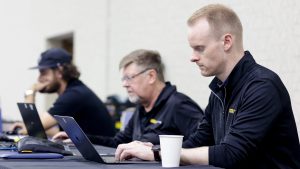 Event producer and executive producer work together behind the scenes at a Tri-Marq event.