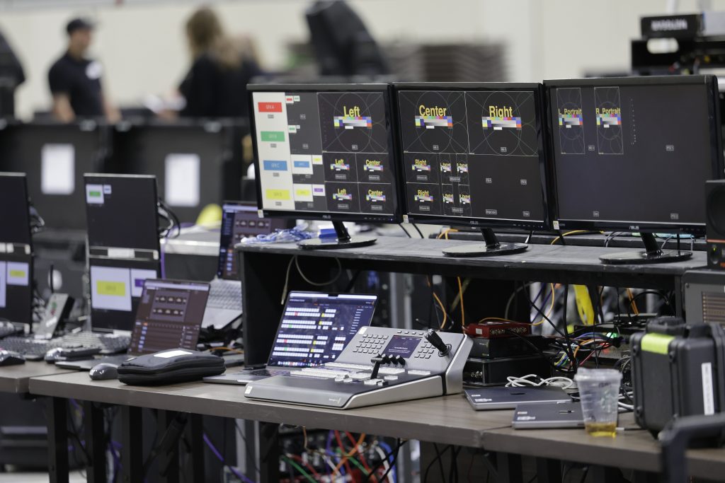 Event tech and computer monitors setup behind the scenes at Numotion's 2026 CGS.